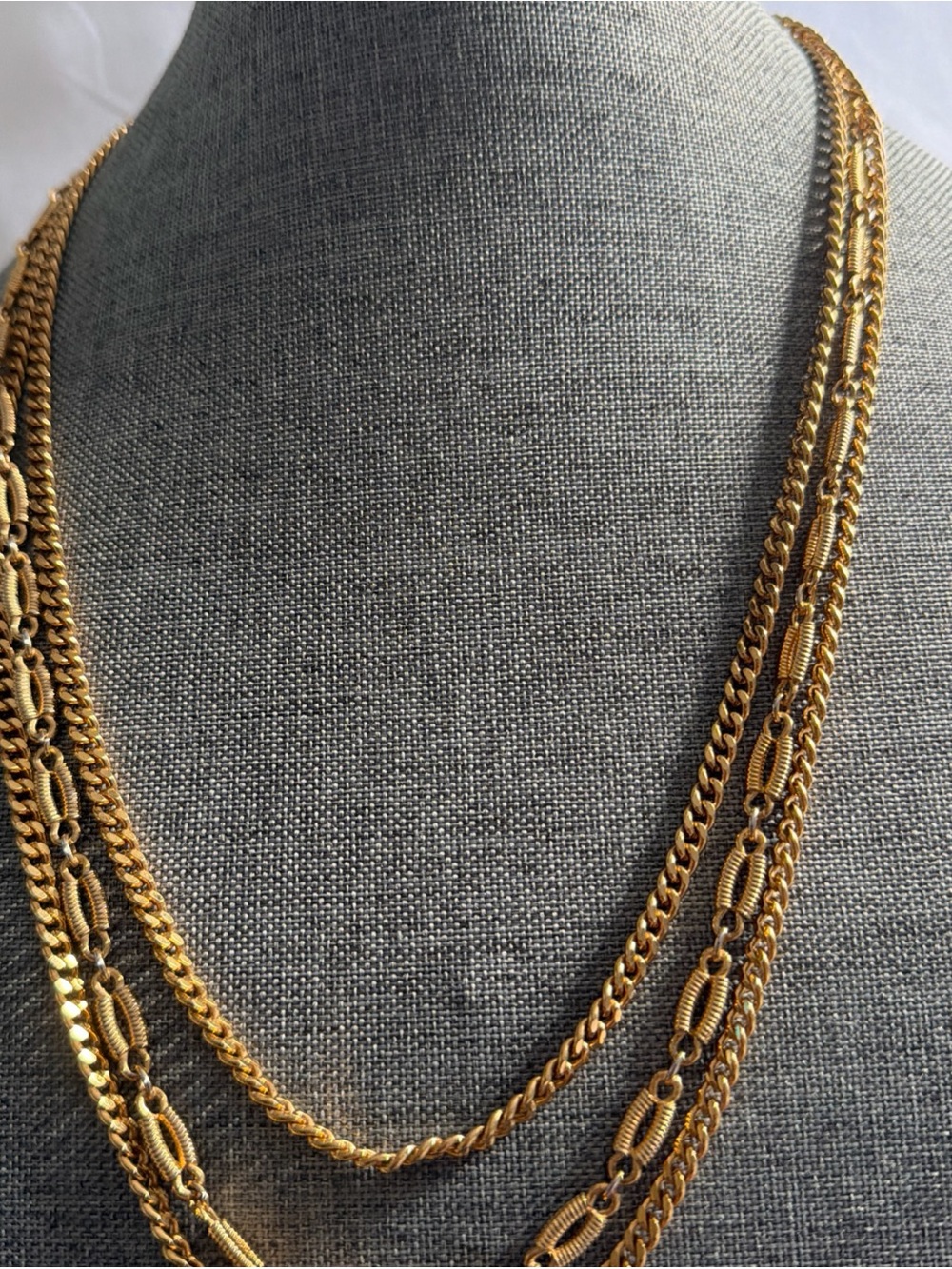 Vintage Monet gold-tone necklace features a layered, multi-strand design
